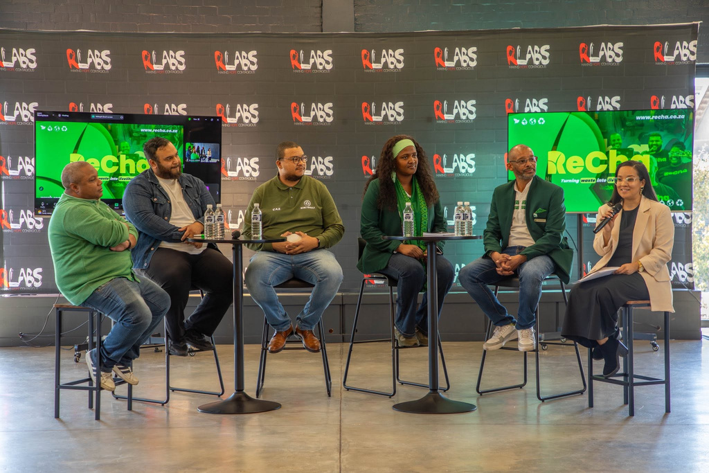 Mishqah Gous hosting a ReCha panel discussion with five speakers