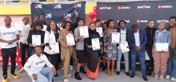 Graduates holding certificates at a DLab Jabulani graduation