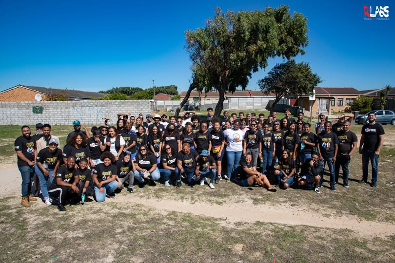 Large RLabs team group photo outdoors